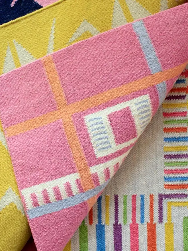 Labourdonnais Flatweave Rug, a colourful rug sitting on a plain surface. 