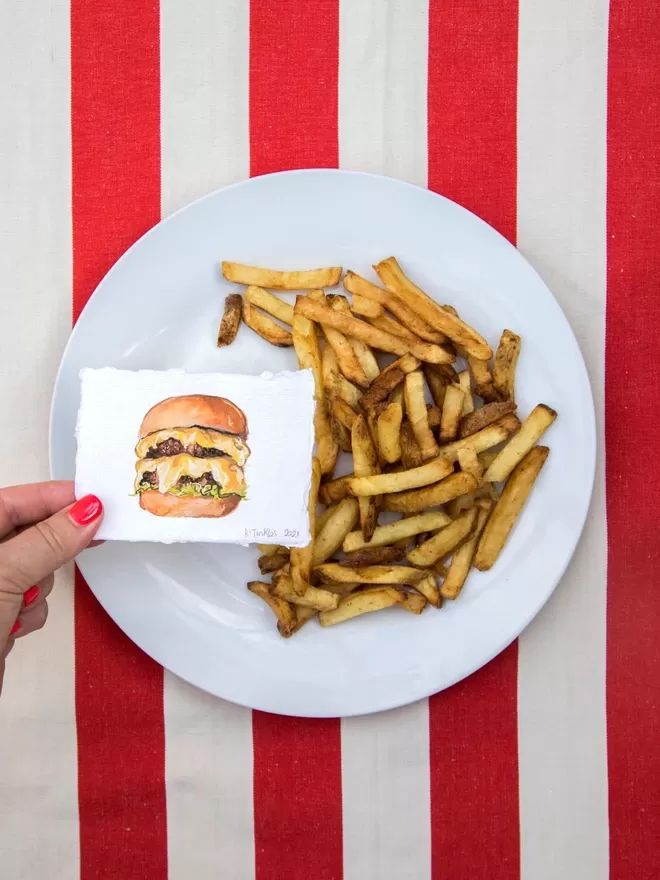 Katie Tinkler illustration of a burger and chips.