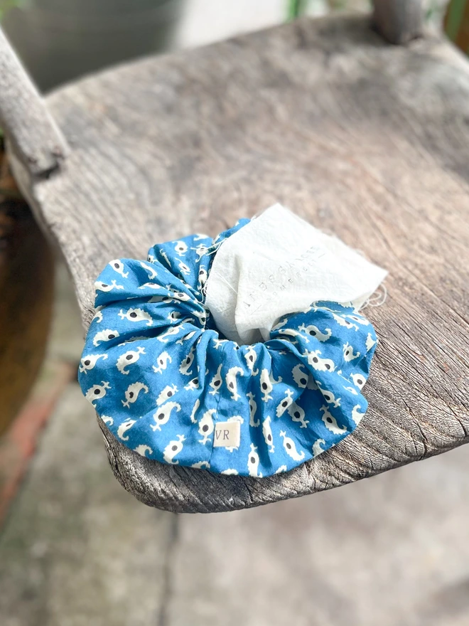 Block print hair scrunchie on a chair in the sunshine