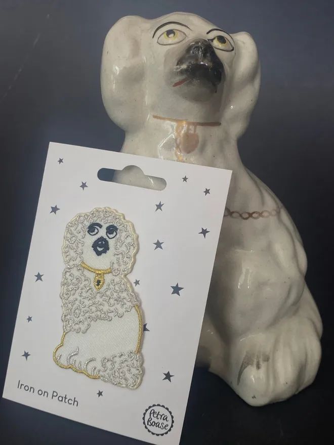 White wally dog patch next to a china white wally dog.