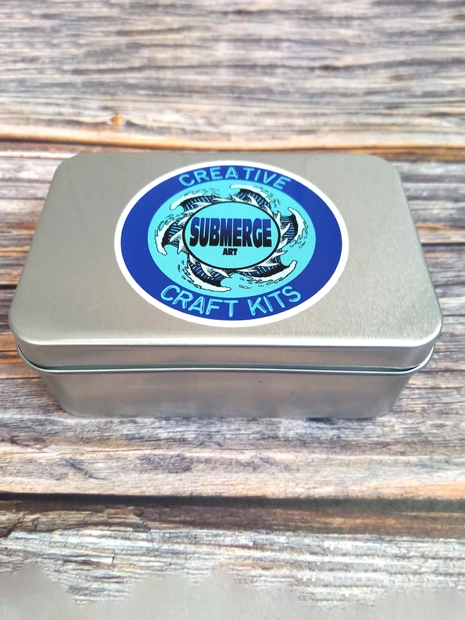 Stamp carving kit in a tin