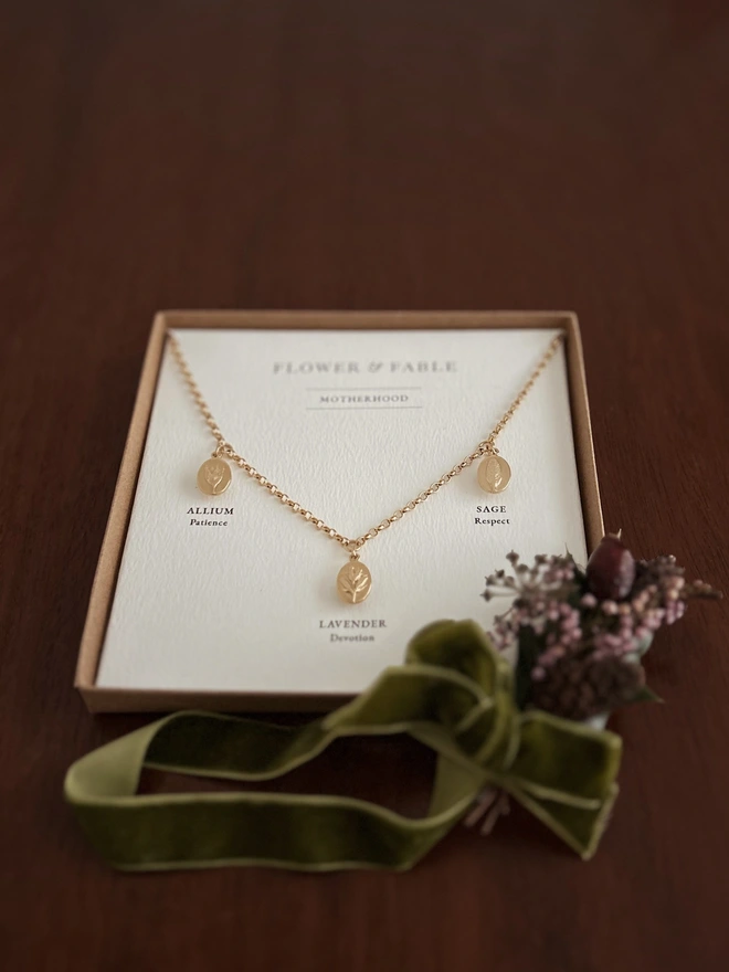 Daughterhood Triple Charm Necklace with presentation box and Christmas posy