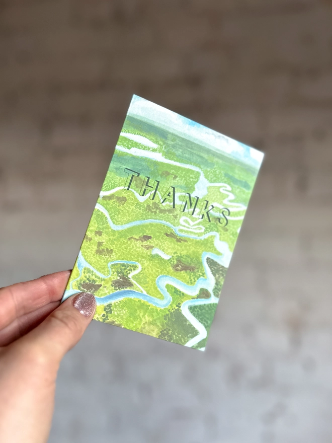 a greetings card featuring an illustration of the everglades landscape with the text “thanks”