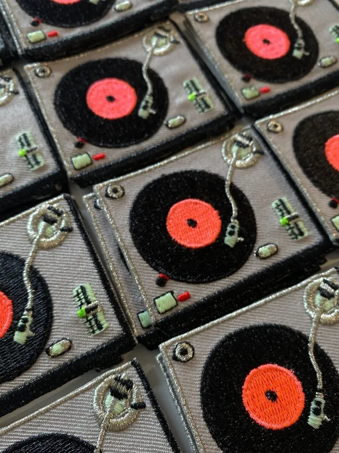 Embroidered record player iron on fabric patch.