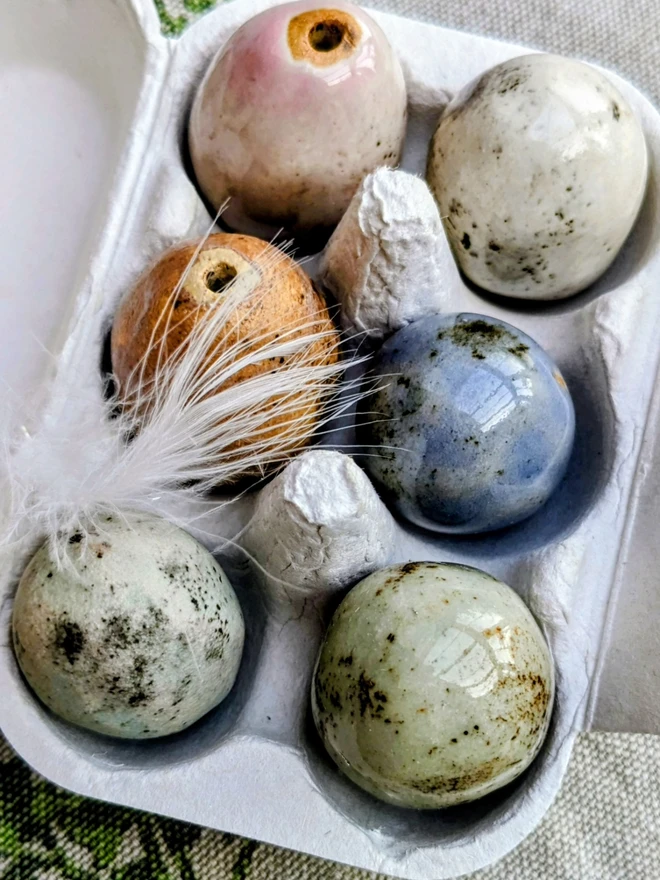 Ceramic eggs in egg box