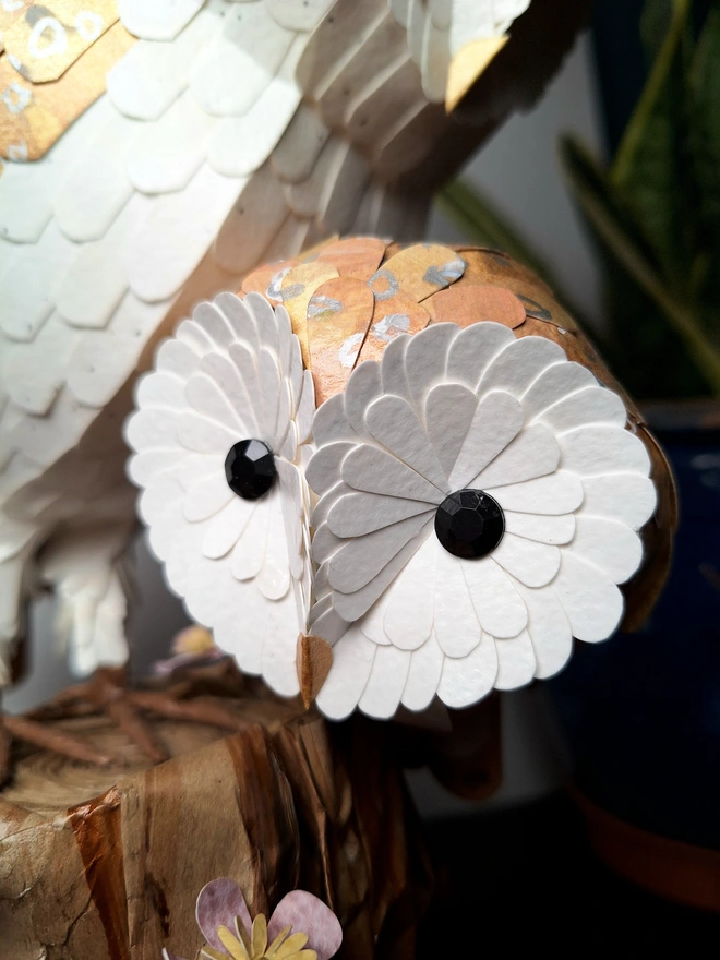 Close up of a baby barn owl sculpture 