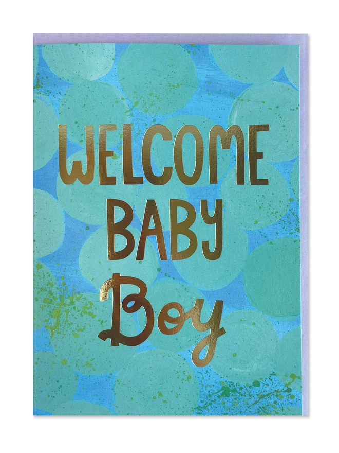 A painterly new baby card with abstract design in vibrant brush strokes of blues and mint. Finished with a gold foil ‘Welcome Baby Boy’ message 