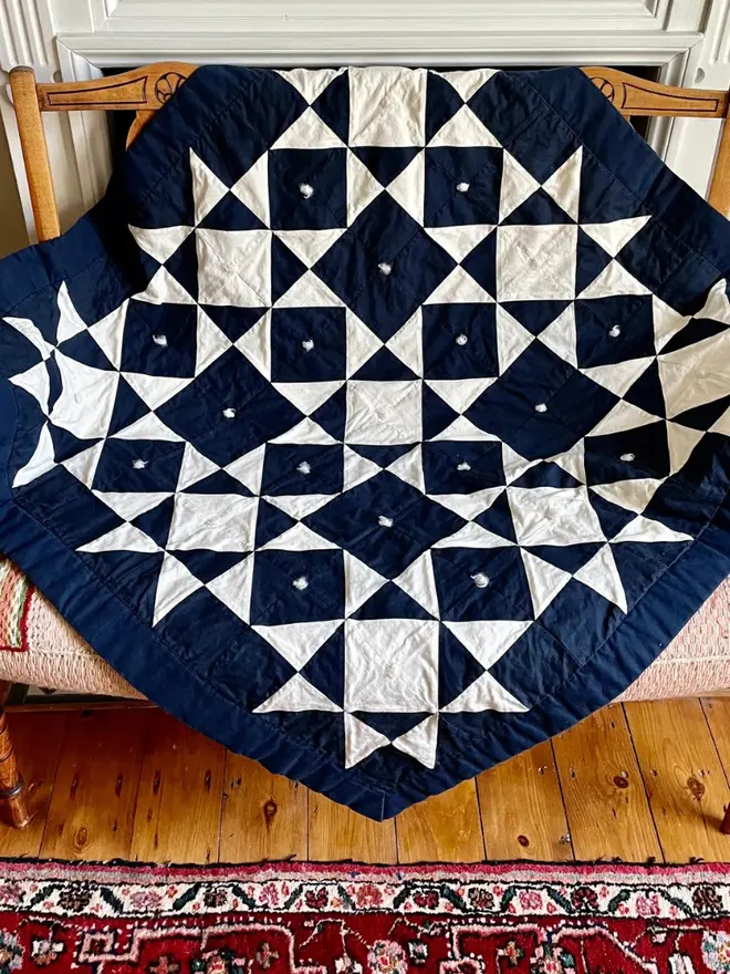 Midnight Quilt Kit, on a sofa. 