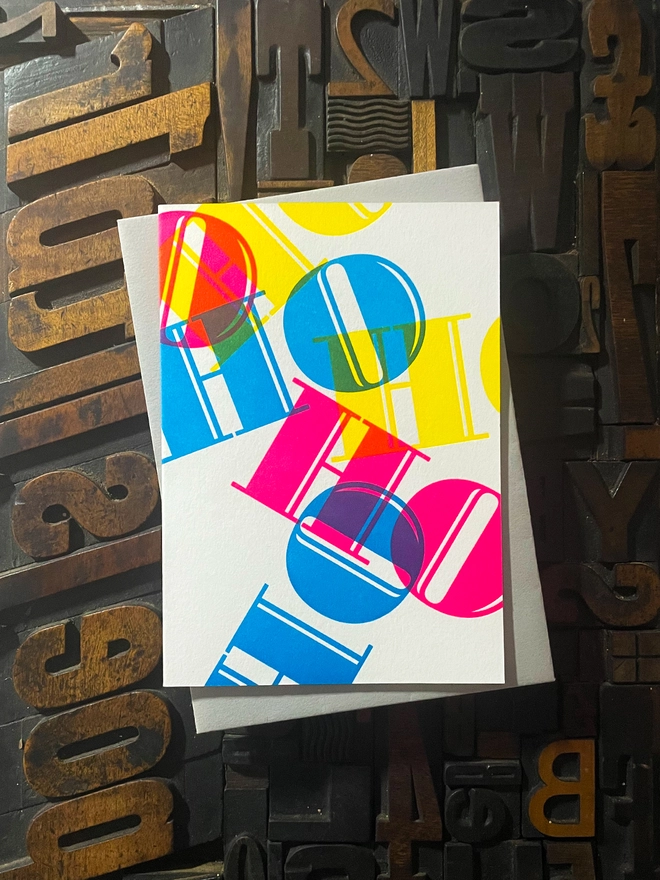 Ho Ho Ho! A beautiful typographic letterpress Christmas card. Printed with rich vibrant and fluorescent blue, magenta and yellow inks with luxury matching and contrasting envelopes; ideal to send to your designer friends at the festive season.