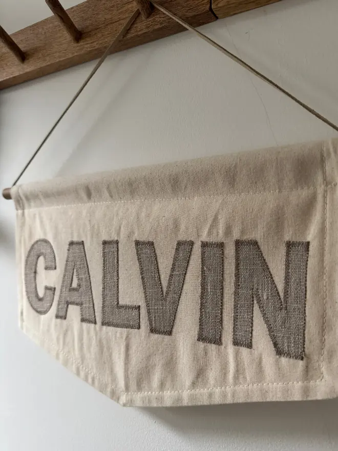 Linen Name Banner.  A banner with the word CALVIN in natural linen