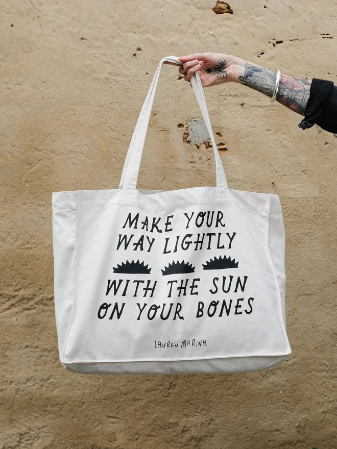 Large canvas tote bag with sun poetry design