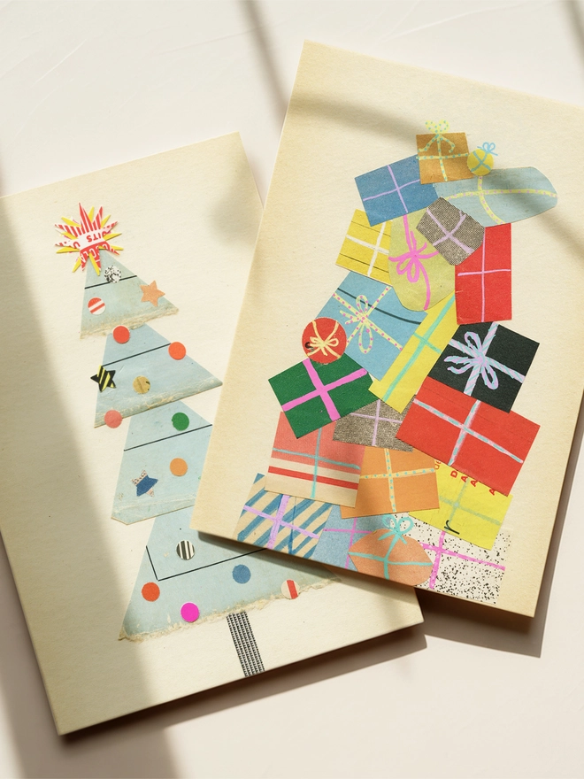 Two colourful Christmas cards featuring a huge pile of presents and a decorated tree.
