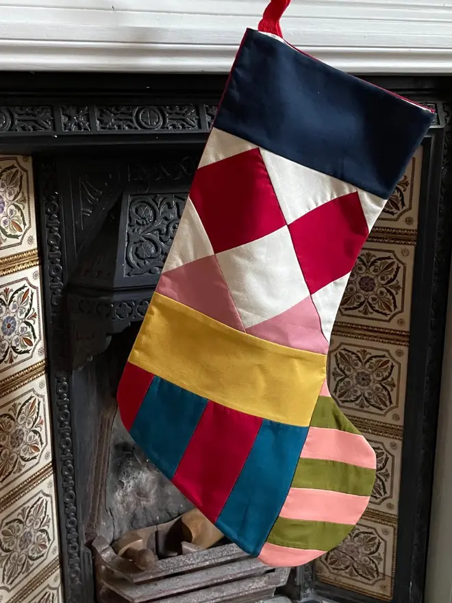 Pagliacci Patchwork Stocking, hanging.