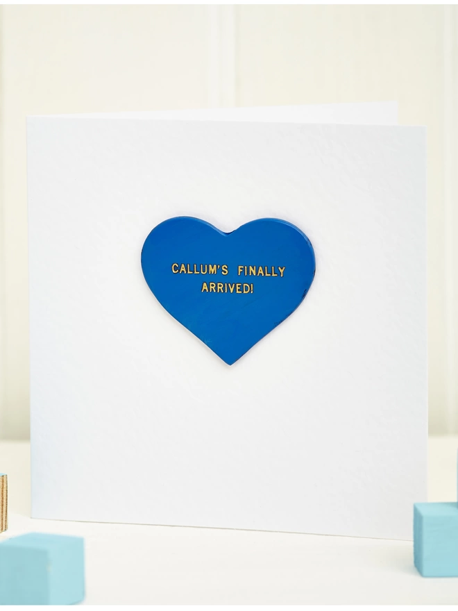 Large Blue Heart with Callum's Finally Here written in gold.