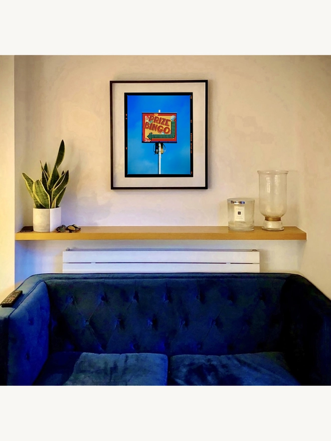 Prize Bingo Richard Heeps colour print framed in black on the living room wall