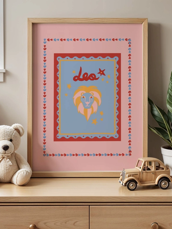 Leo star sign print Leo horoscope print astrology print digital print decorative print with a pink backdrop and red floral boarder 