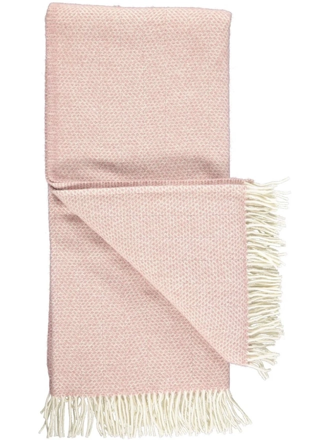 Organic Wool Throw, an organic wool throw folded on a white surface. 