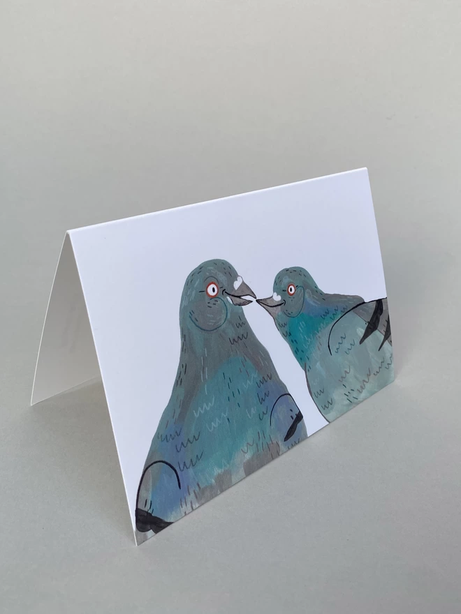 Illustration of two pigeons in love on landscape A6 greeting card 