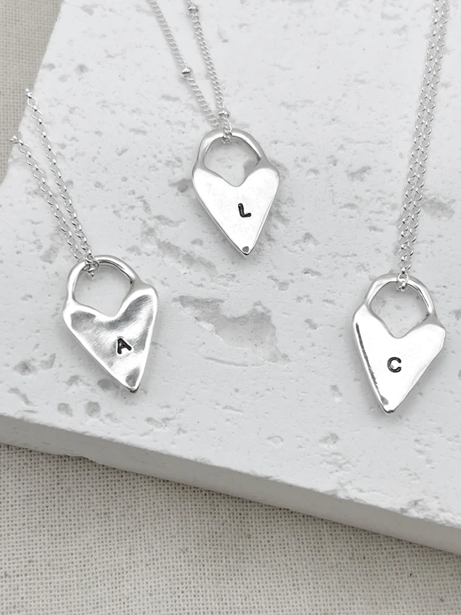 Hand made heart talisman charms made from 100% recycled sterling silver, cute gift for girlfriend or wife for Valentine's Day or Mother's Day. Send straight to your special someone. Made by Celina C Jewellery, a small business in the UK, find on Holly and Co.