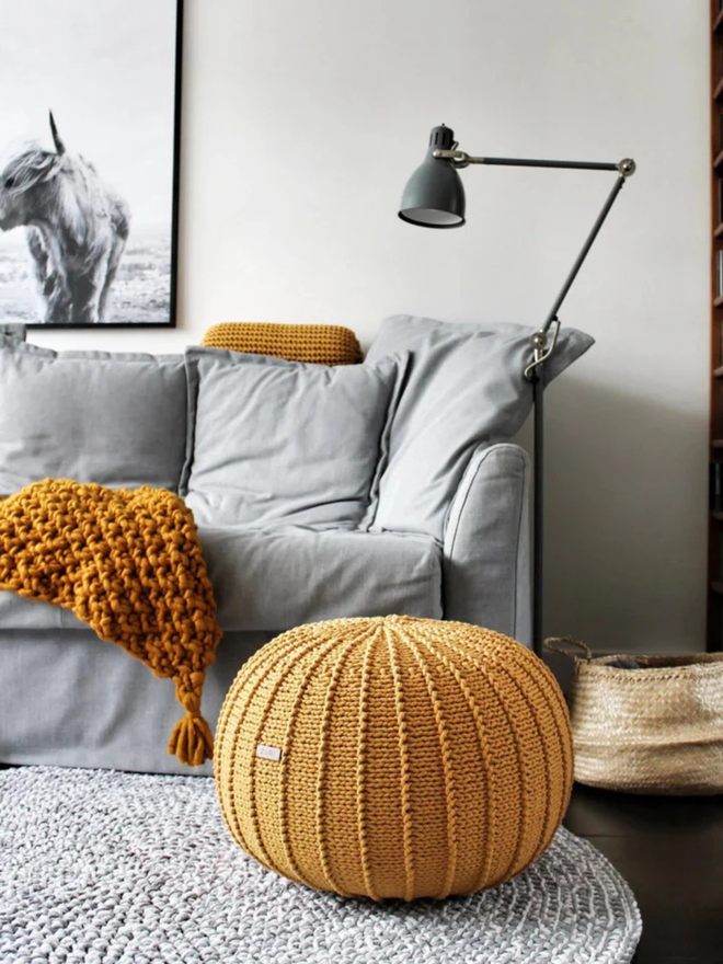 Zuri House. Large mustard knitted pouffe.