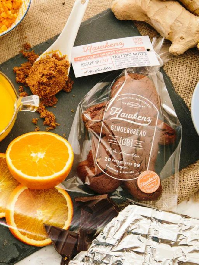 artisan chocolate orange gingerbread men in packaging lifestyle shot