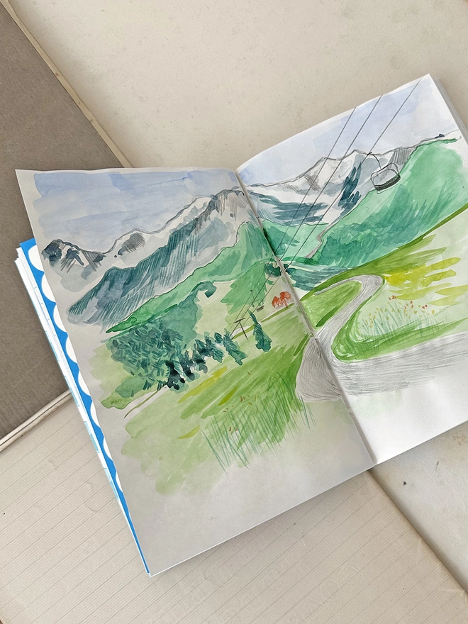 Inside pages of the journal showing painted picture
