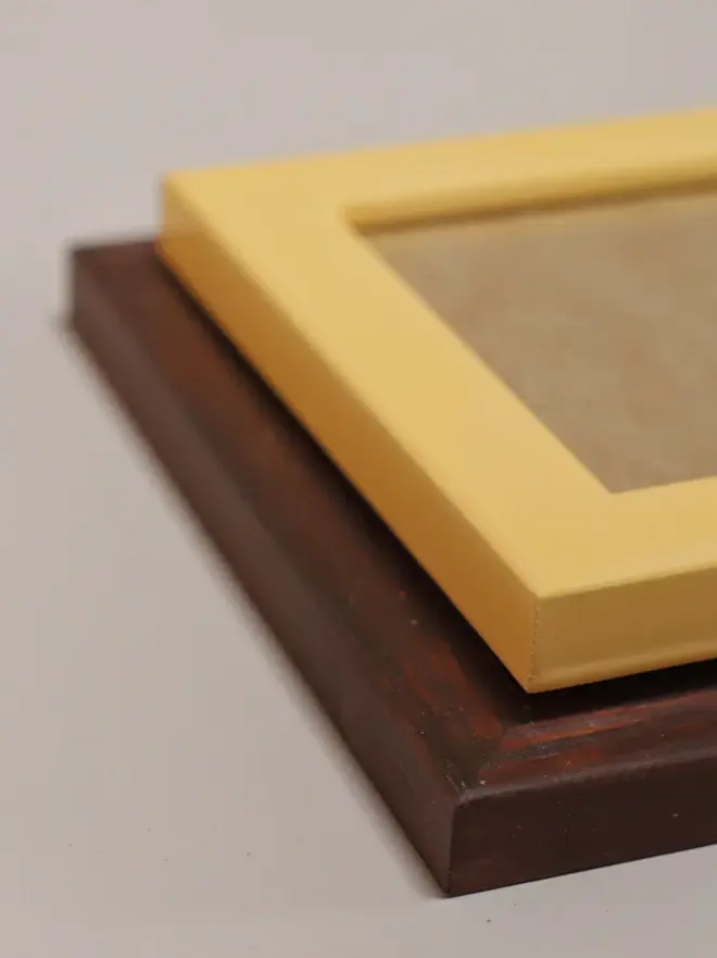 brown and yellow empty flat wood picture frames