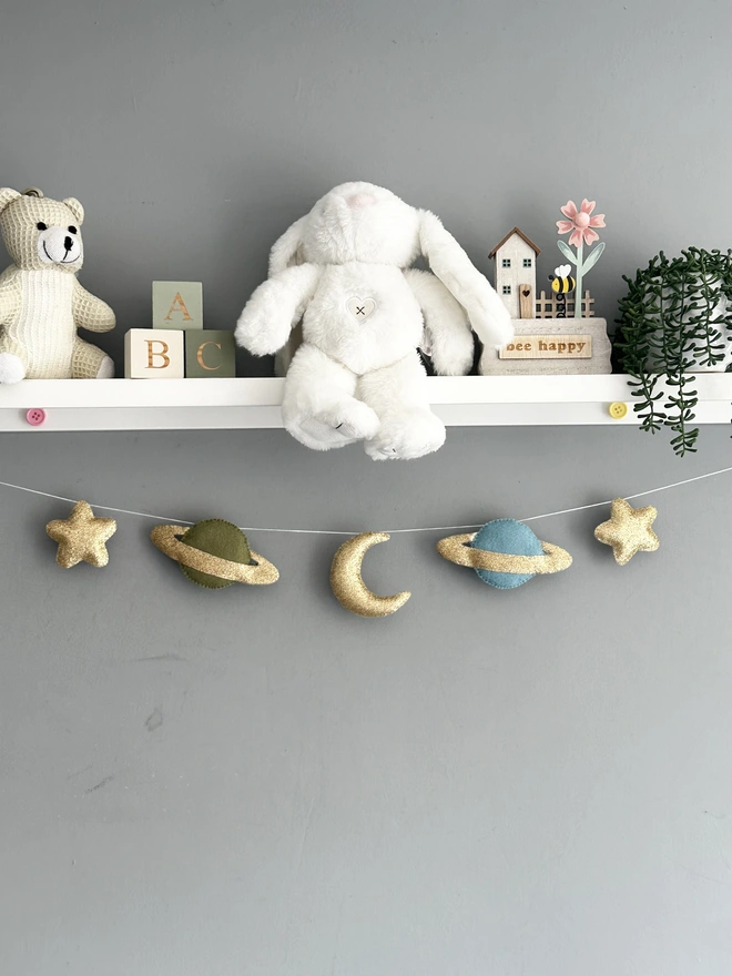 Planet And Stars themed garland hanging in a child’s bedroom, nursery decoration, baby gift