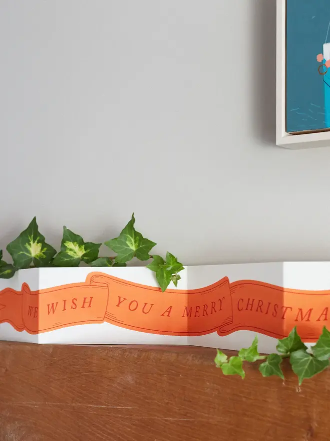 giant concertina christmas card banner on shelf