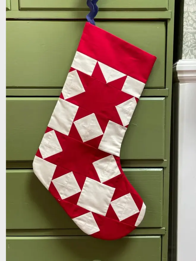 Aster Patchwork Stocking, hanging. 