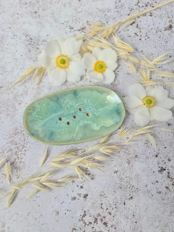 Bathroom, Handcrafted ceramic soap dish in Aqua glaze with turquoise and green tones, photographed with flowers on a white grainy background, gift, homeware, bathroom accessories, bathroom decor, Jenny Hopps Pottery, J.Hopps Pottery, J.H Pottery
