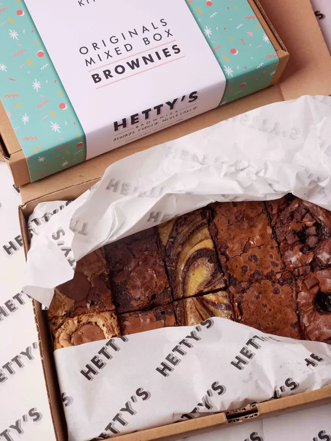 Ten slices of Hetty's brownie original flavours of marbled cheesecake, salted caramel, classic fudge, cookie dough and chocolate orange all boxed up in branded packaging