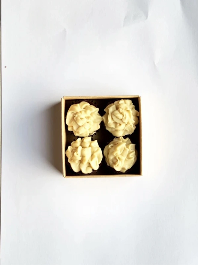 Irish Stout Chocolate Cups Made With Real Stout (Box Of 4), a box of chocolates sitting on a plain white surface. 