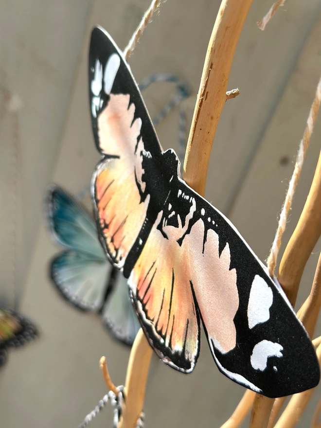Hand Painted Butterfly Colourful Linocut Hanging Decoration In Orange Peach and black