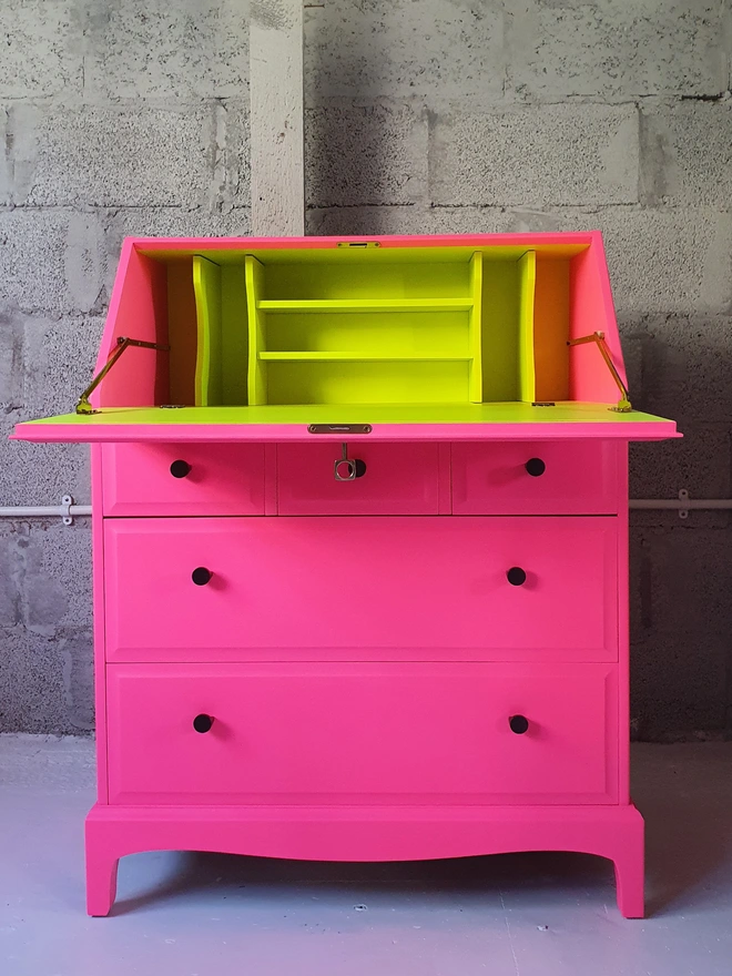 neon pink yellow bureau desk