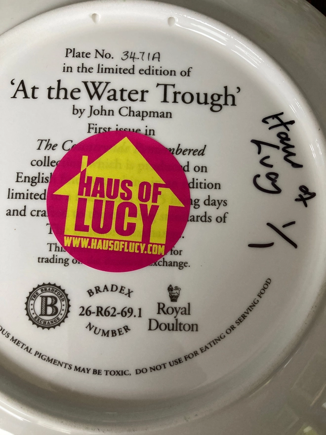 Rear of the plate, with a Haus of Lucy signature and Haus of Lucy sticker.