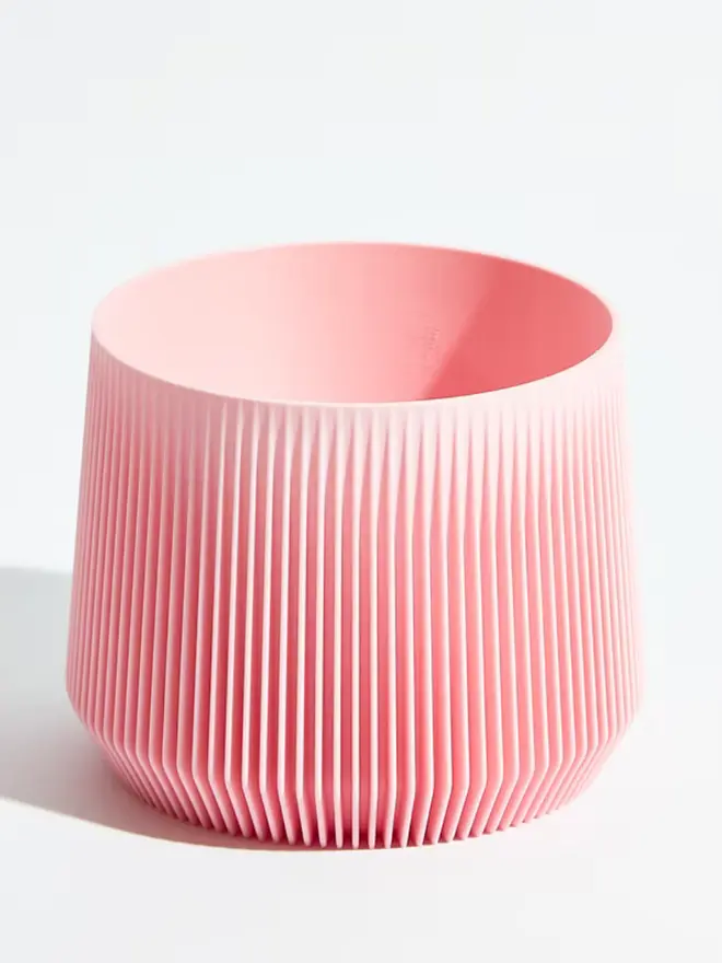 Sustainable 3D Printed Sakura Pink Plant Pot, pillar design, against a white background.