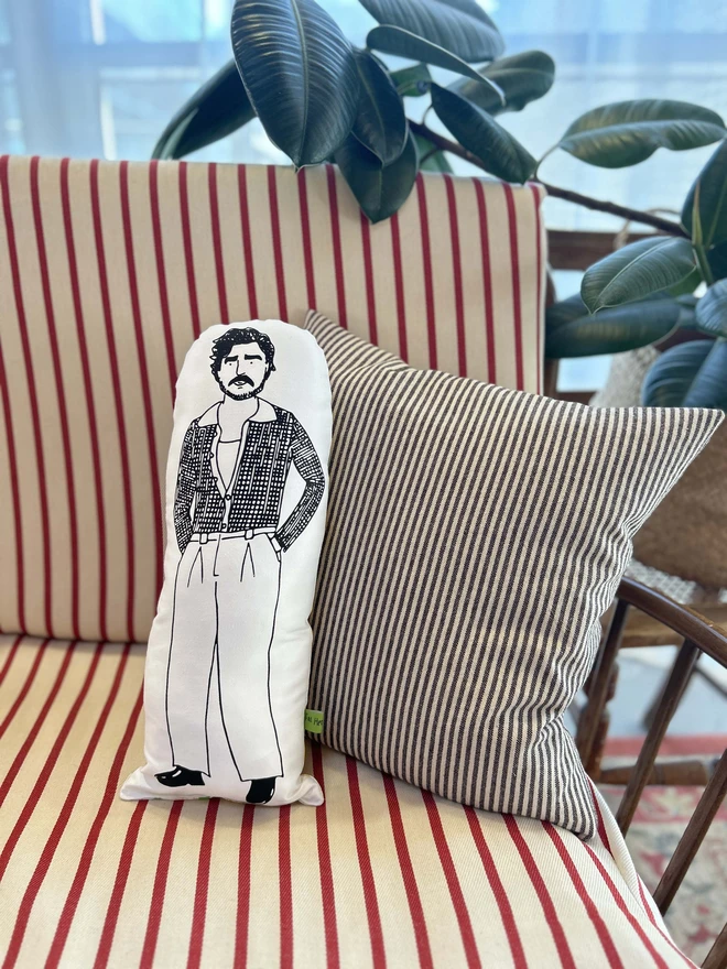 Black and white cushion featuring an illustration of Pedro Pascal.