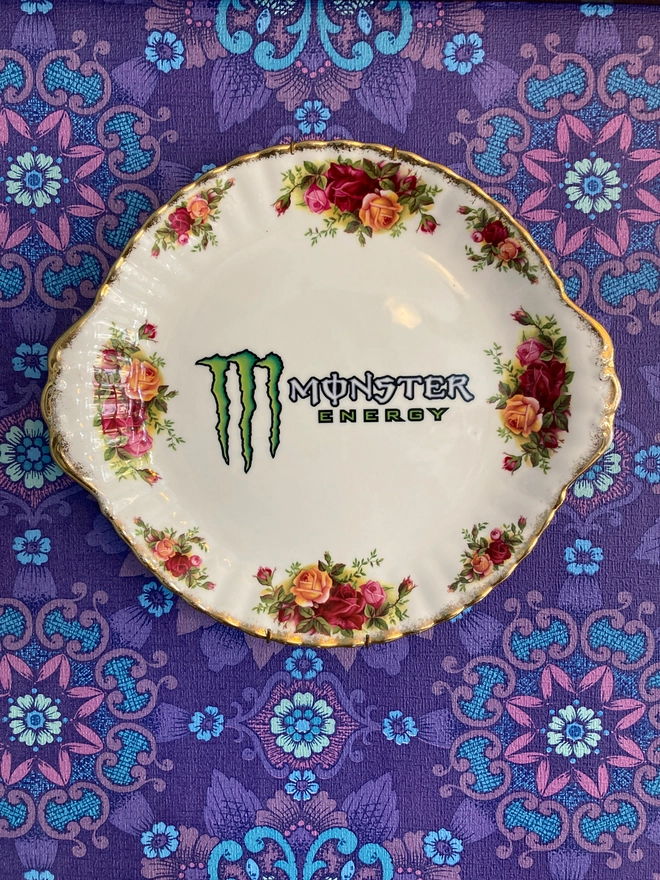 Vintage floral plate featuring the 'Monster Energy' logo
