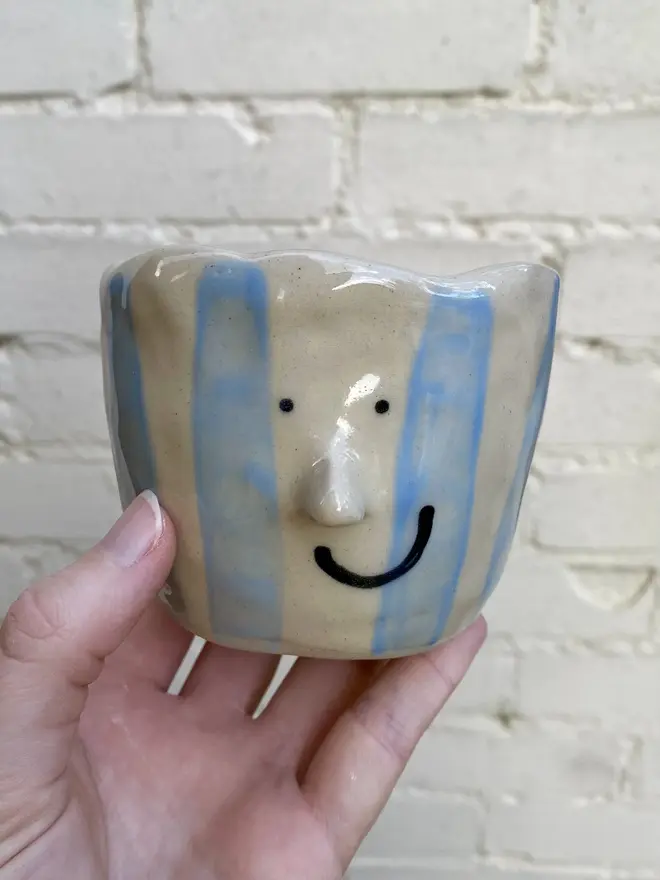 blue white stripe handmade ceramic smiley face pot