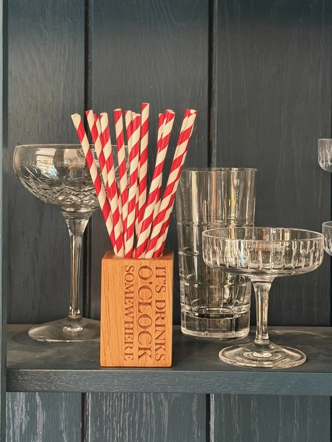Stripy straws in a straw cup with engraving