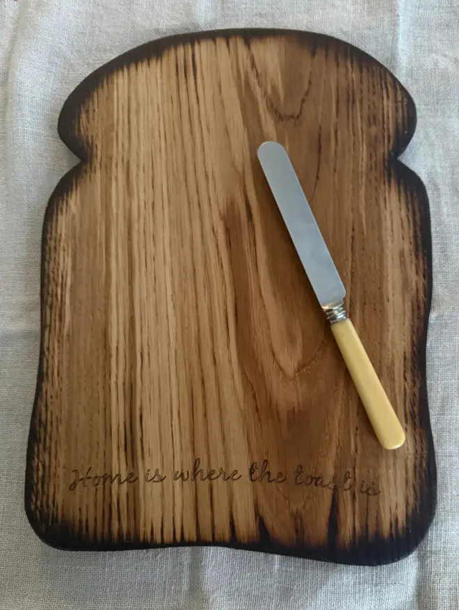 Large toast shaped board with engraving home us where the toast is