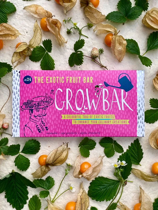 The Exotic Fruit Growbar on a background of cape gooseberry and alpine strawberries.