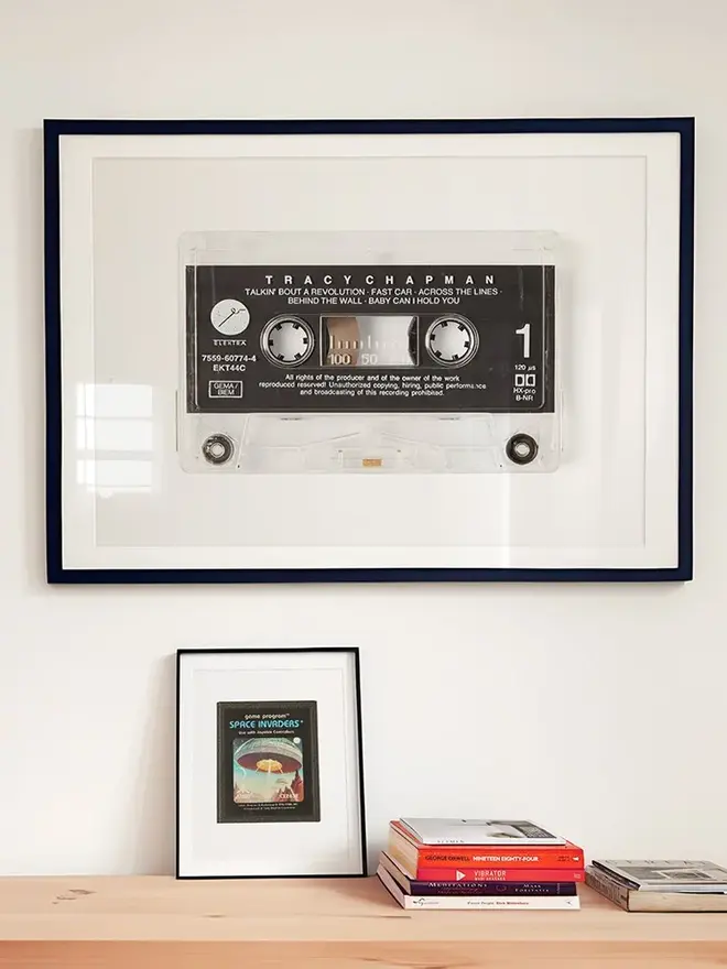 tracy chapman fast car cassette tape print. framed print hung on white wall.