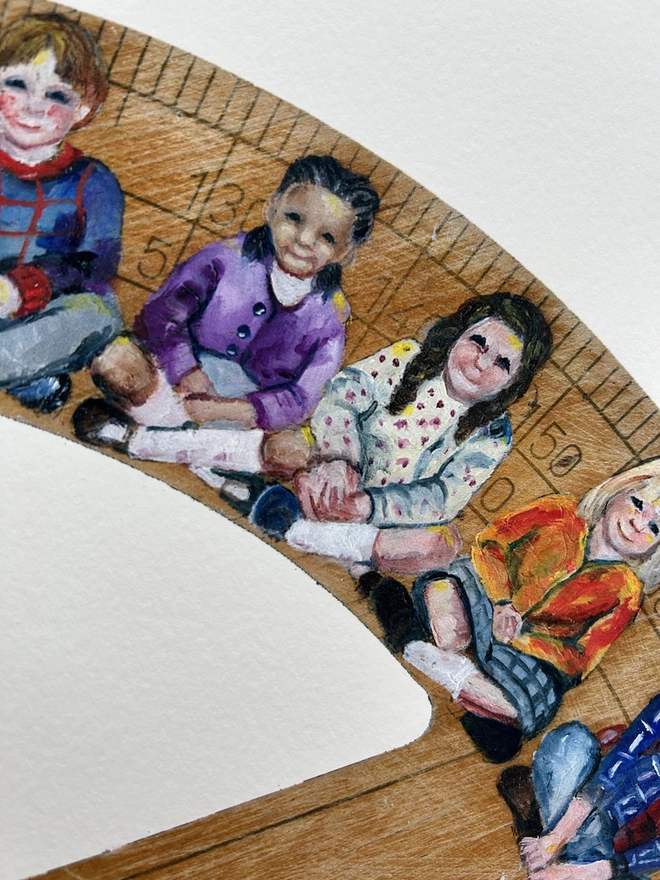 four children sitting on cross-legged children painted classroom protractor