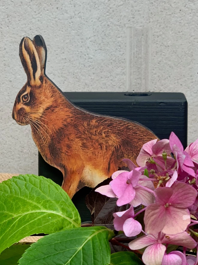 Decorative vase with hare cut out detail.