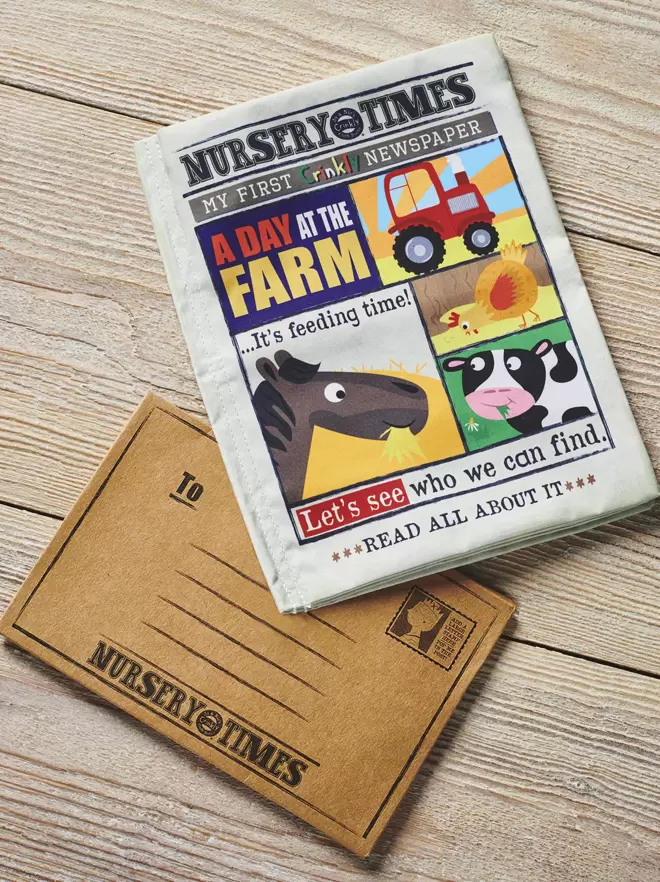 A Day at the Farm crinkly cloth book front cover overlapping brown card envelope