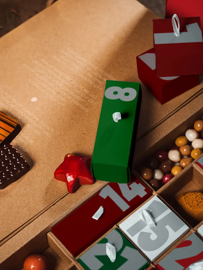 Advent calendar open, close up shot, showing xmas themed chocolate bonbons