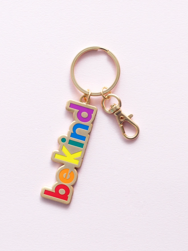 Enamel keyring with 'Be Kind' design in rainbow colours