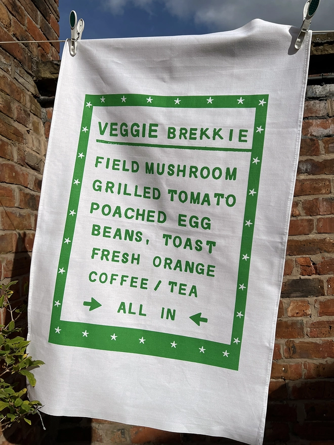 Mr.PS Veggie Brekkie Tea towel hanging in the sunshine